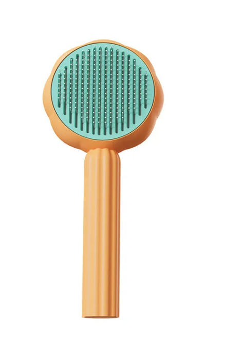 Nuzzl Self-Cleaning Deshedding Brush in orange