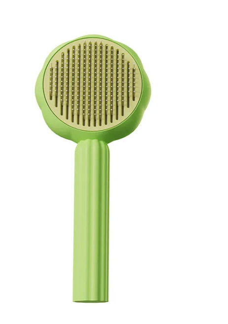 Nuzzl Self-Cleaning Deshedding Brush in green